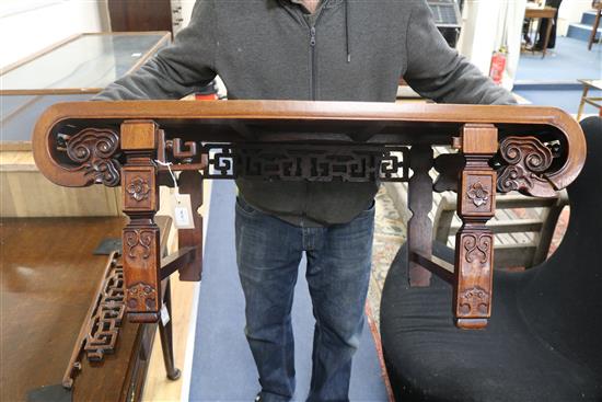 A Chinese carved hardwood low table (a.f.) W.92cm